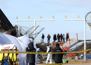 Empty desks and tears mark 5 colleagues killed in South Korean aircraft crash