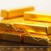 Gold slips as US-Iran tensions carry oil, US rate-hike bets weigh
